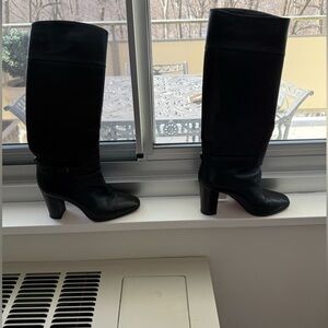Christian Louboutin Black leather boots with ankle straps.